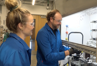 Professor Phillip Christopher and a graduate student discuss equipment inside his state-of-the-art lab.