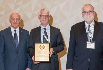 UCSB chemical engineering professor James B. Rawlings (center) received the 2025 Richard E. Bellman Control Heritage Award, which he accepted alongside 2006 Bellman awardee Tamer Basar (left) and Robert Judd, president of the American Automatic Control Council. 