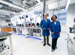 Staff scientists stand among the state-of-the-art equipment of the new Ex-FAB facility. 